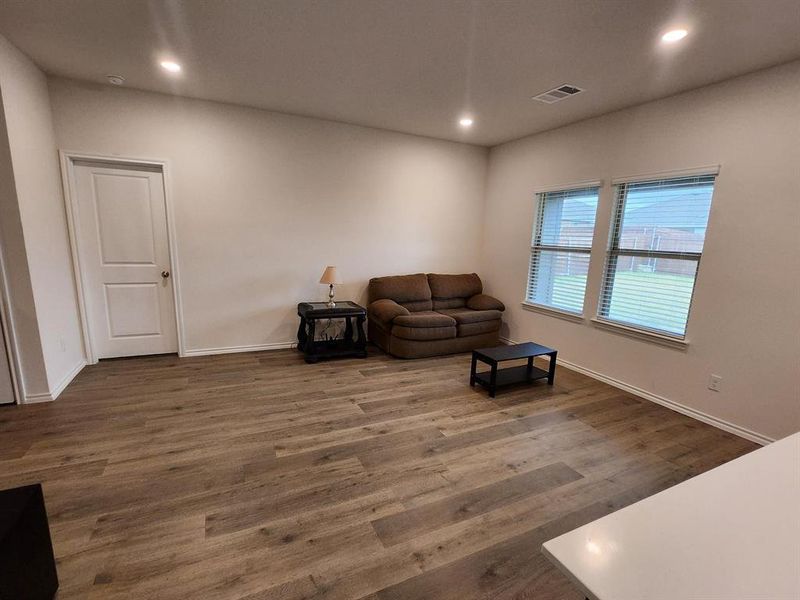 Unfurnished room with recessed lighting and dark wood-style floors