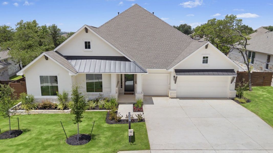 Front exterior of a new home in Riverstone, Georgetown, TX, highlighting curb appeal (Image 18).