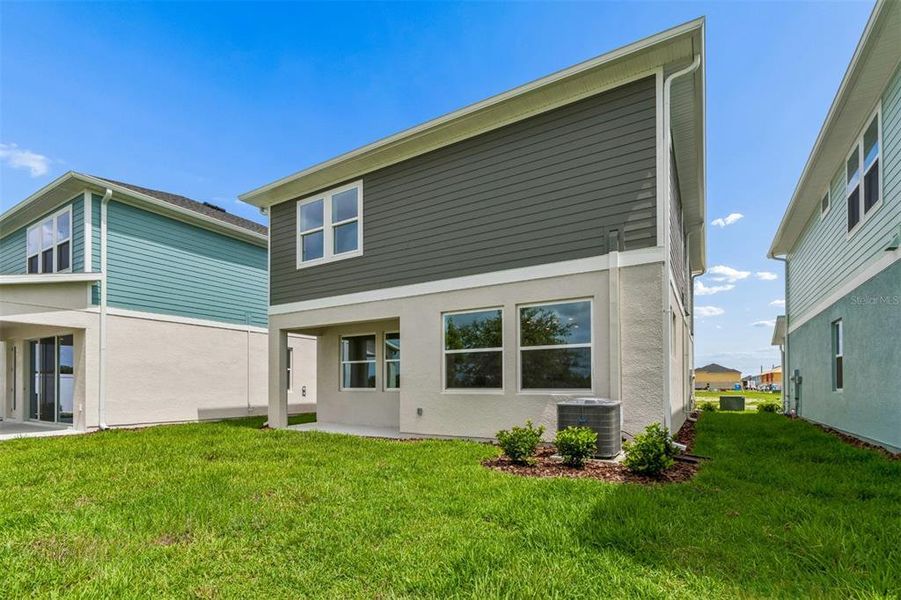 Exterior details and patio area of a home in Persimmon Place – Garden Series, Wesley Chapel (Image 3).