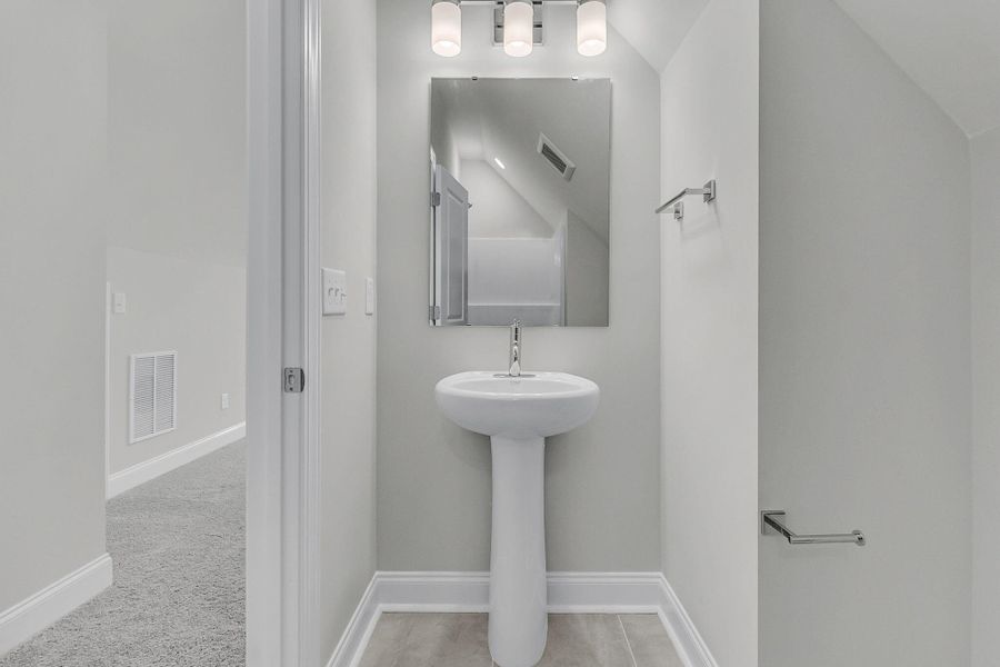 Furnished interior view inside a new home in Tidewater at Lakes of Cane Bay, Summerville (Image 6).