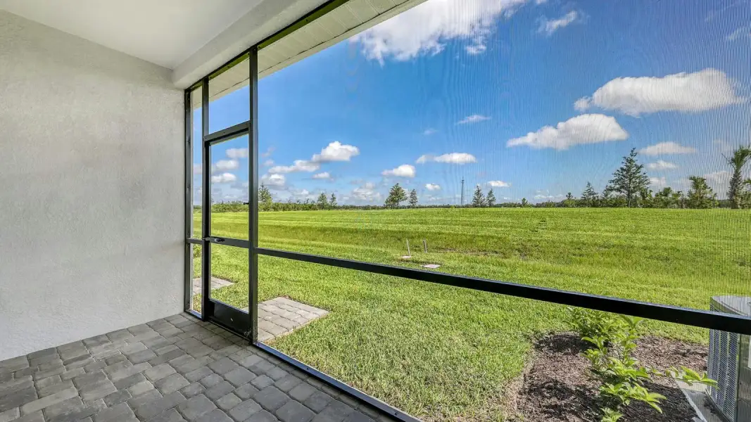 Exterior details and patio area of a home in Palm Grove Real Estate and Homes for Sale in Lakewood Ranch, FL - Neal Communities, Lakewood Ranch (Image 4).