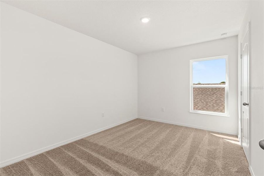 Spacious, unfurnished interior of a new home in Peach Crossings, Winter Haven (Image 20).