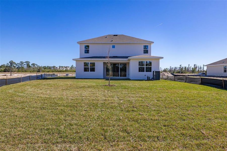 Exterior details and patio area of a home in Serenade at Ovation, Winter Garden (Image 4). Exterior details and patio area of a home in Serenade at Ovation, Winter Garden (Image 4).