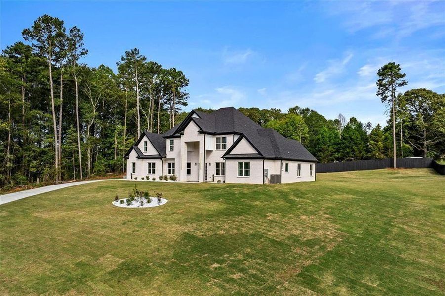 Front exterior of a new home in , Loganville, GA, highlighting curb appeal (Image 24).