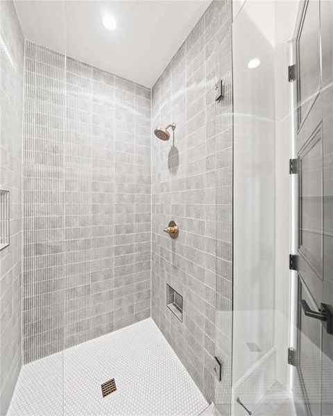 Full bath featuring a shower stall and recessed lighting