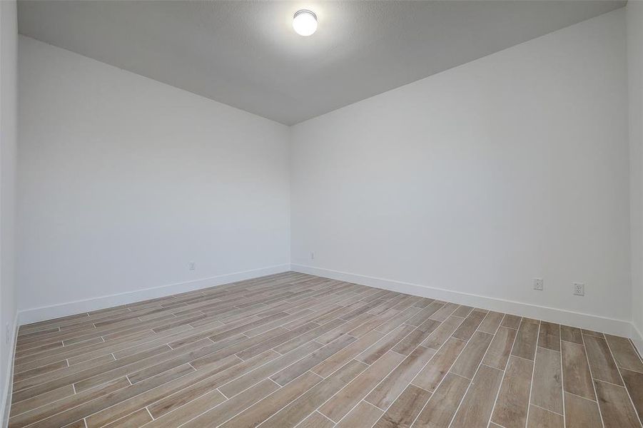 Alternate angle of the primary bedroom. 10ft ceilings allow stretch into every inch of this one-of-a-kind home.