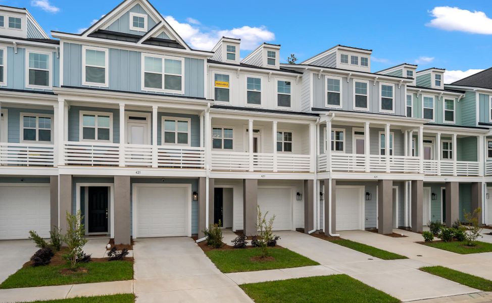 Front exterior of a new home in New Riverside Village, Bluffton, SC, highlighting curb appeal (Image 2). Front exterior of a new home in New Riverside Village, Bluffton, SC, highlighting curb appeal (Image 2).