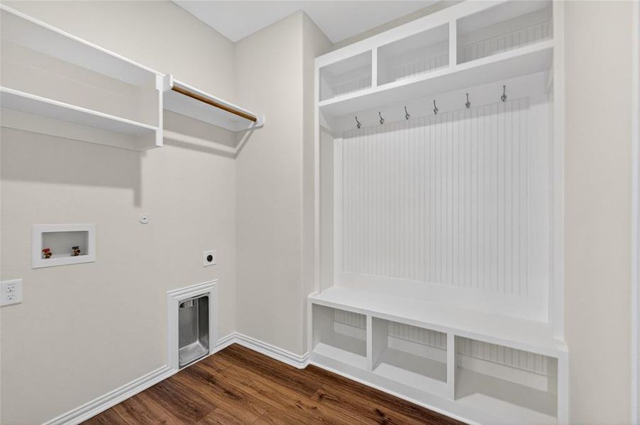 Washroom with hookup for a gas dryer, dark wood finished floors, electric dryer hookup, and hookup for a washing machine