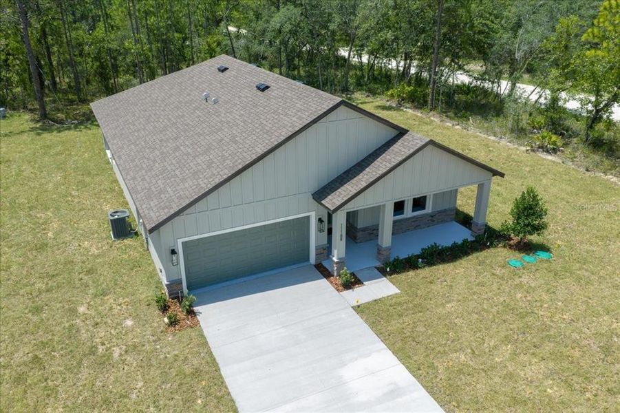 Front exterior of a new home in , Weeki Wachee, FL, highlighting curb appeal (Image 35). Front exterior of a new home in , Weeki Wachee, FL, highlighting curb appeal (Image 35).