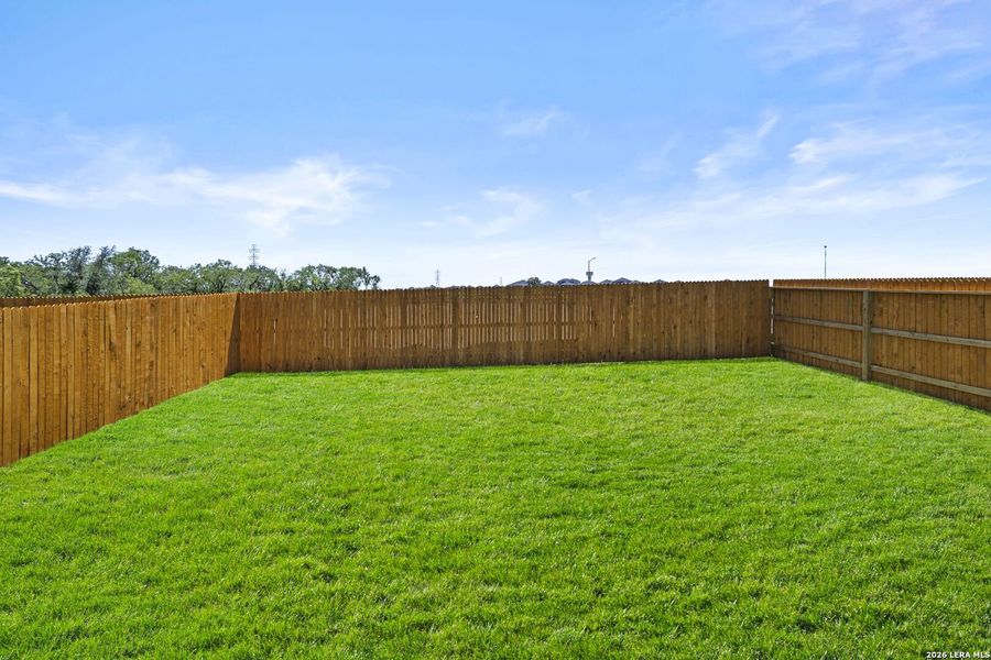 Exterior details and patio area of a home in Hickory Ridge, Elmendorf (Image 17).