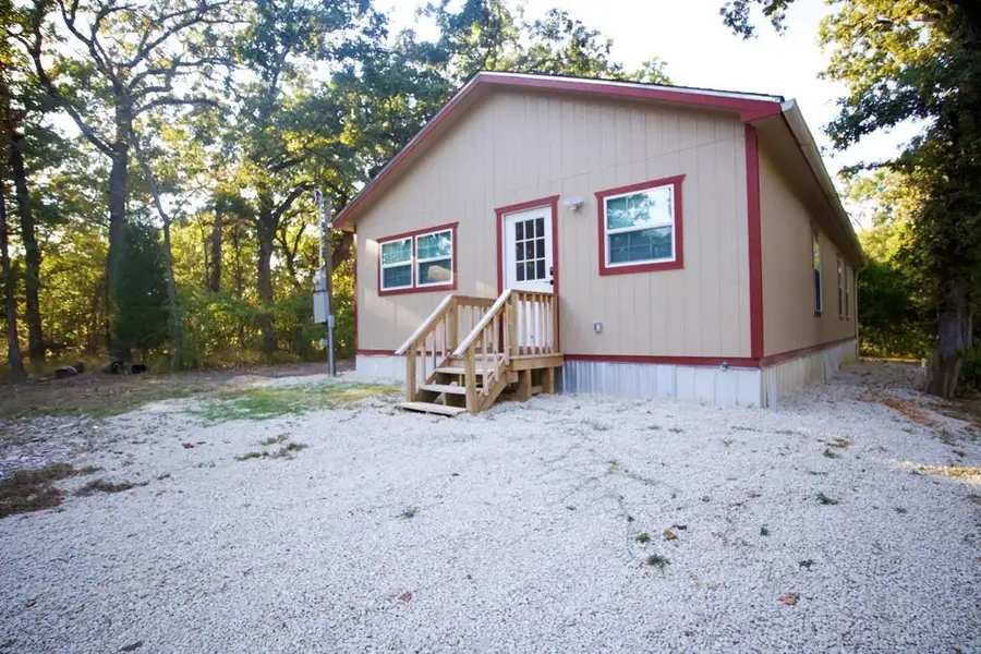 Exterior details and patio area of a home in , Log Cabin (Image 1). Exterior details and patio area of a home in , Log Cabin (Image 1).