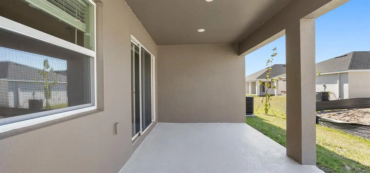 Exterior details and patio area of a home in VillaMar, Winter Haven (Image 3).