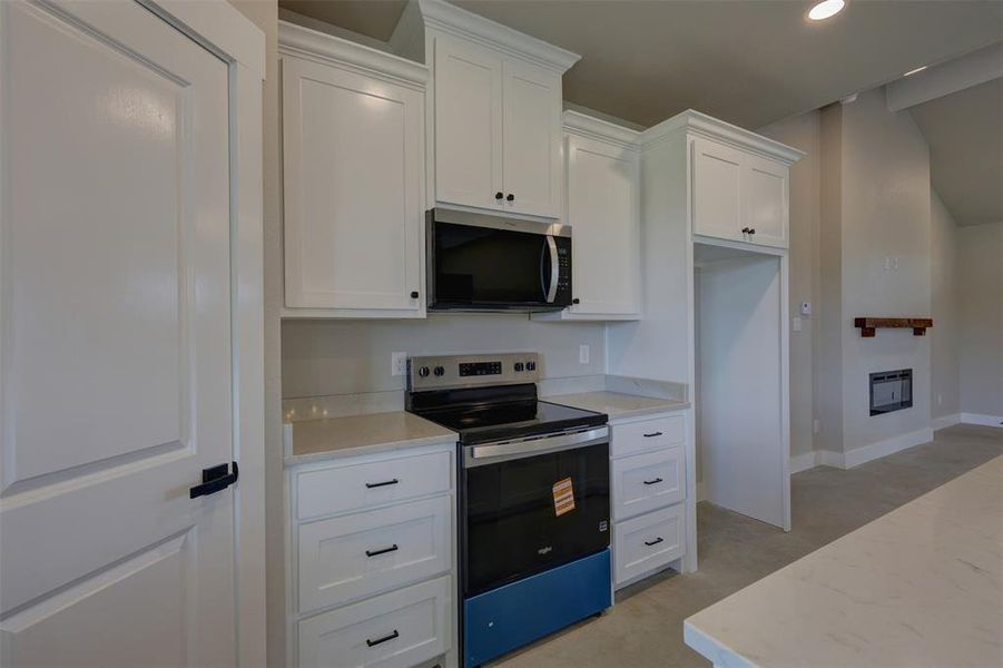 Furnished interior view inside a new home in , Whitney (Image 12).