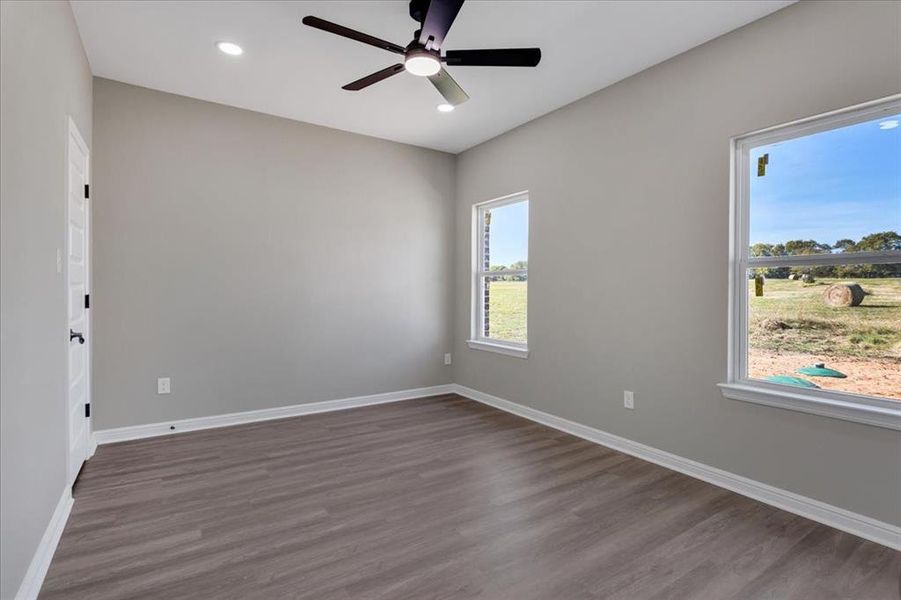 Unfurnished room with dark wood-style floors, recessed lighting, and ceiling fan