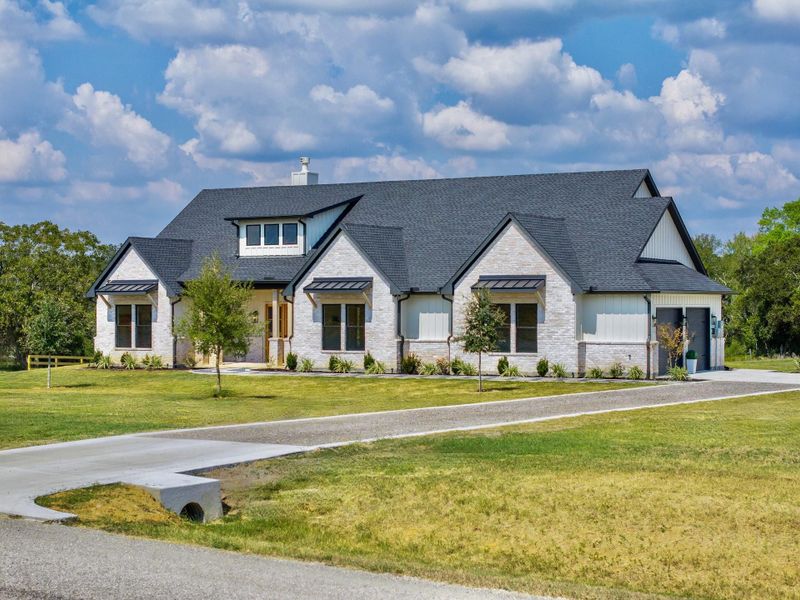 Front exterior of a new home in , Chappell Hill, TX, highlighting curb appeal (Image 24).