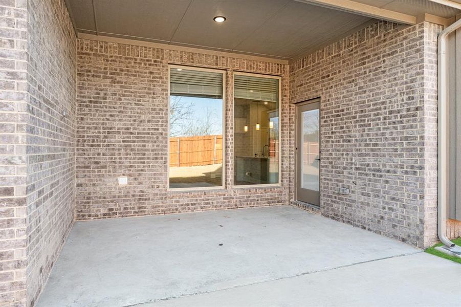 Exterior details and patio area of a home in The Grove, Midlothian (Image 24).