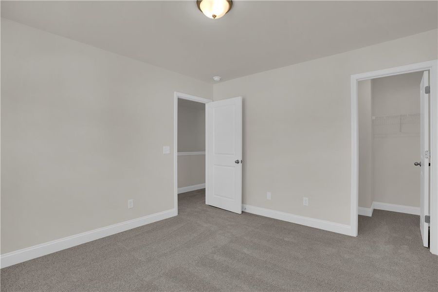 This spacious bedroom offers ample natural light, This spacious bedroom offers ample natural light,