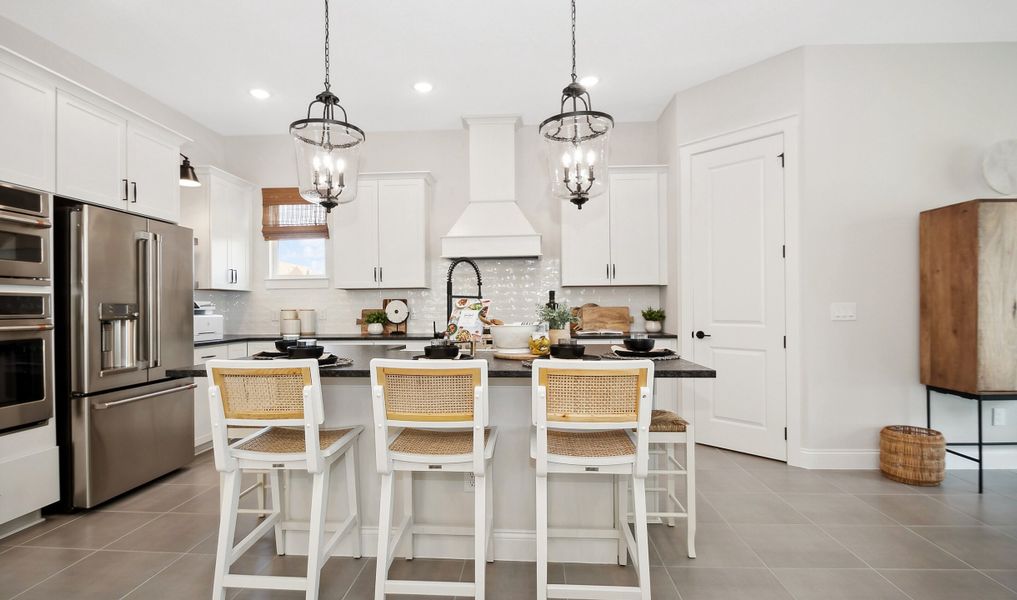 Kitchen with spacious island and pendant lights