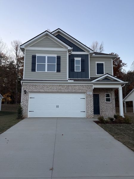 Front exterior of a new home in Marlin Pointe, White House, TN, highlighting curb appeal (Image 1).
