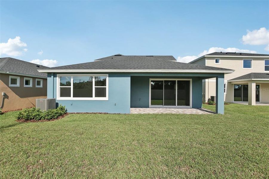 Front exterior of a new home in Primrose at Longleaf, New Port Richey, FL, highlighting curb appeal (Image 1).