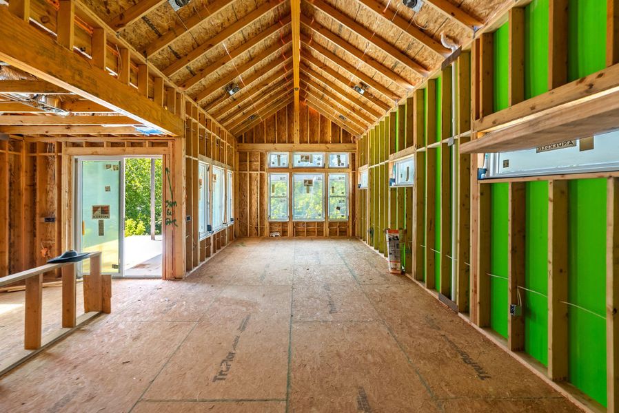 Miscellaneous room featuring lofted ceiling