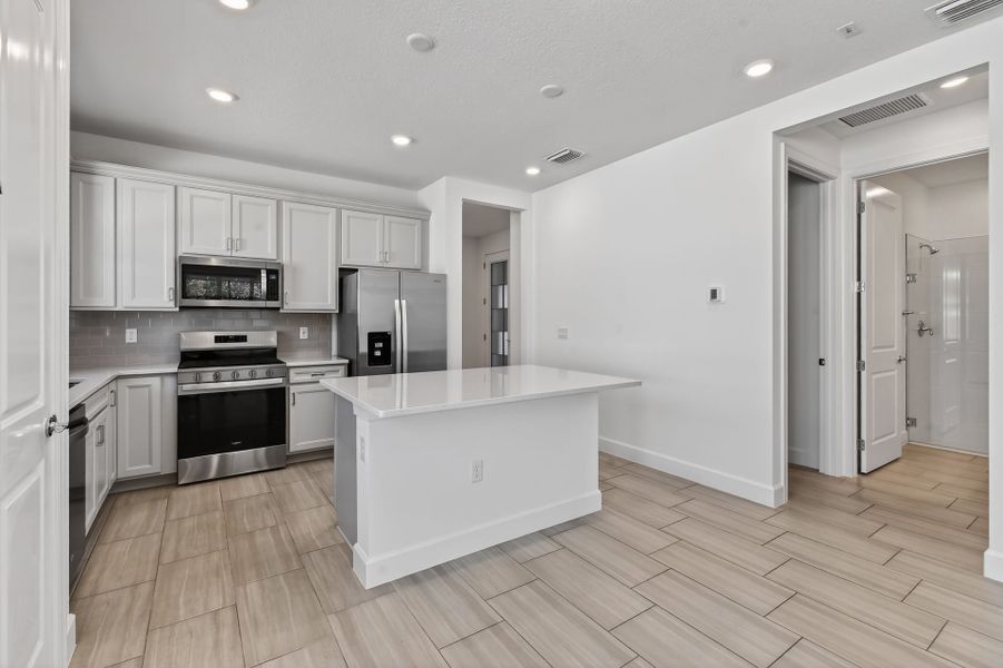 Furnished interior view inside a new home in Costa Pointe, Vero Beach (Image 8).