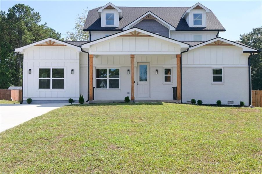 Front exterior of a new home in , Loganville, GA, highlighting curb appeal (Image 30).