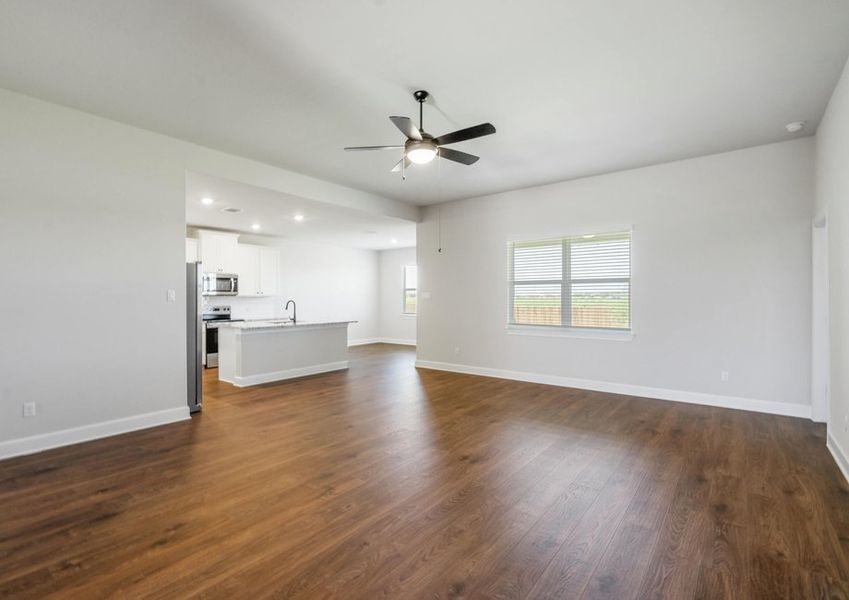 Family room with a window overlooking the backyard
