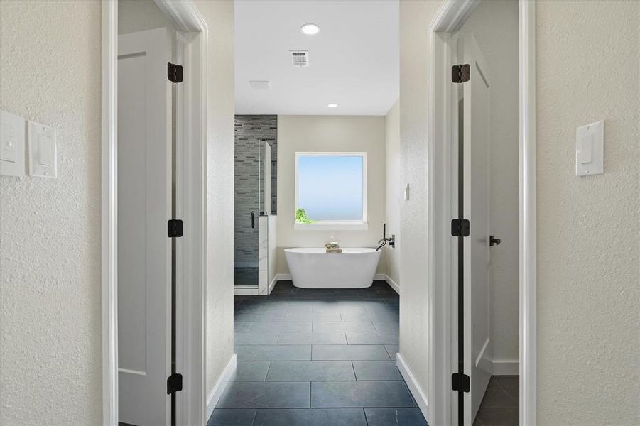 Dual walk in closets as you enter into the primary bath