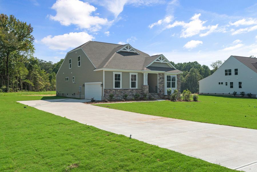 Front exterior of a new home in Redland, Advance, NC, highlighting curb appeal (Image 19). Front exterior of a new home in Redland, Advance, NC, highlighting curb appeal (Image 19).