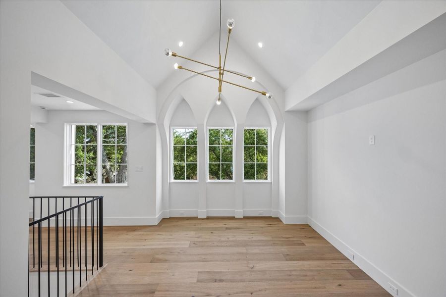 Upstairs Gameroom with vaulted ceiling and handsome chandelier Upstairs Gameroom with vaulted ceiling and handsome chandelier