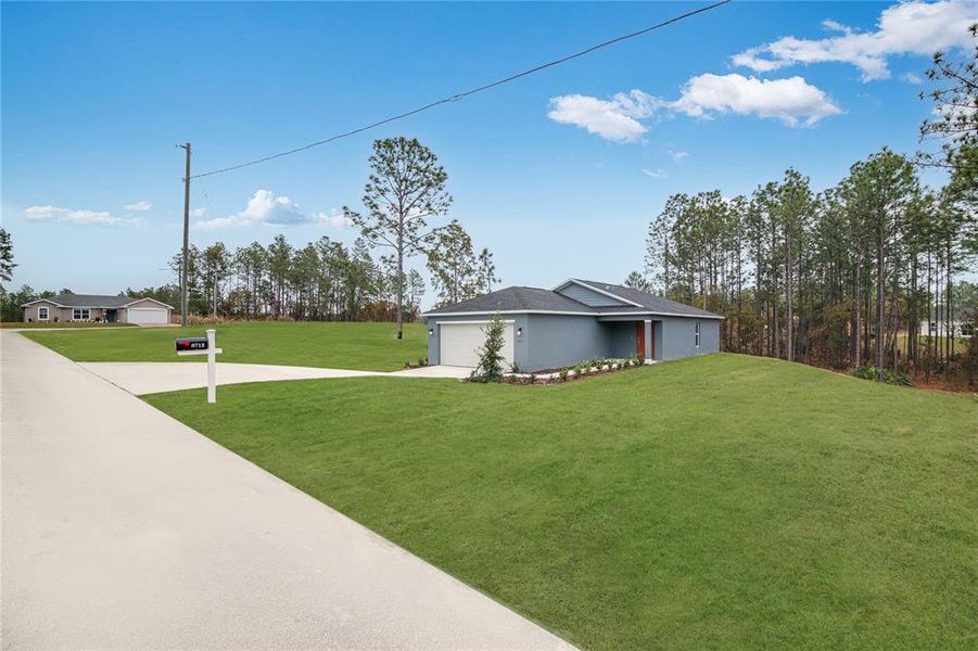 Front exterior of a new home in Marion Oaks, Ocala, FL, highlighting curb appeal (Image 7).