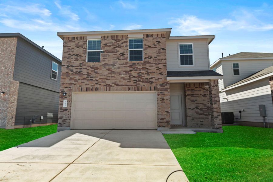 Front exterior of a new home in Sunset Oaks: Ridgepointe Collection, Maxwell, TX, highlighting curb appeal (Image 2). Front exterior of a new home in Sunset Oaks: Ridgepointe Collection, Maxwell, TX, highlighting curb appeal (Image 2).