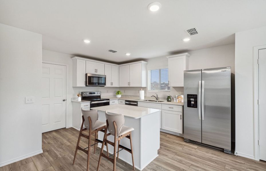 Kitchen featuring a large island ideal for informal dining and gatherings