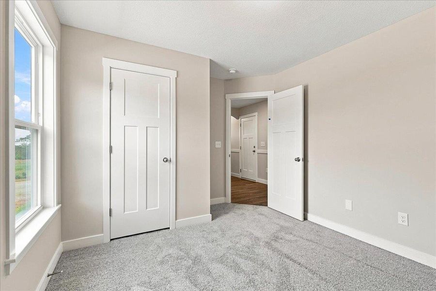Spacious, unfurnished interior of a new home in Davis Heights, Inman (Image 27).