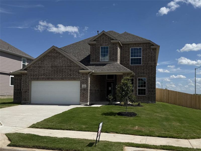 Front exterior of a new home in Rocky Creek Crossing, Fort Worth, TX, highlighting curb appeal (Image 2). Front exterior of a new home in Rocky Creek Crossing, Fort Worth, TX, highlighting curb appeal (Image 2).