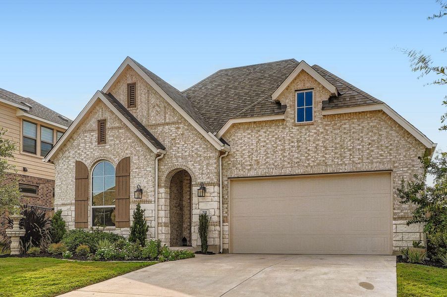 Front exterior of a new home in 6 Creeks at Waterridge: 55ft. lots, Kyle, TX, highlighting curb appeal (Image 19).