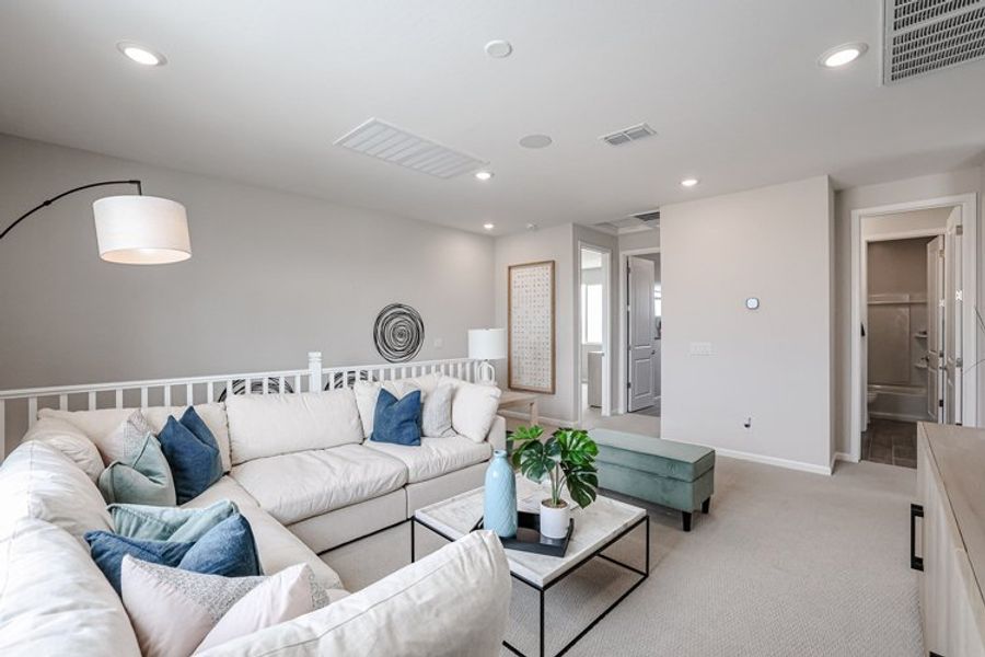 A living room with white couches. A living room with white couches.