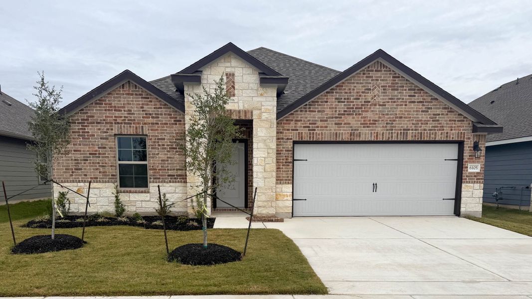 Front exterior of a new home in Southern Pointe, College Station, TX, highlighting curb appeal (Image 1).