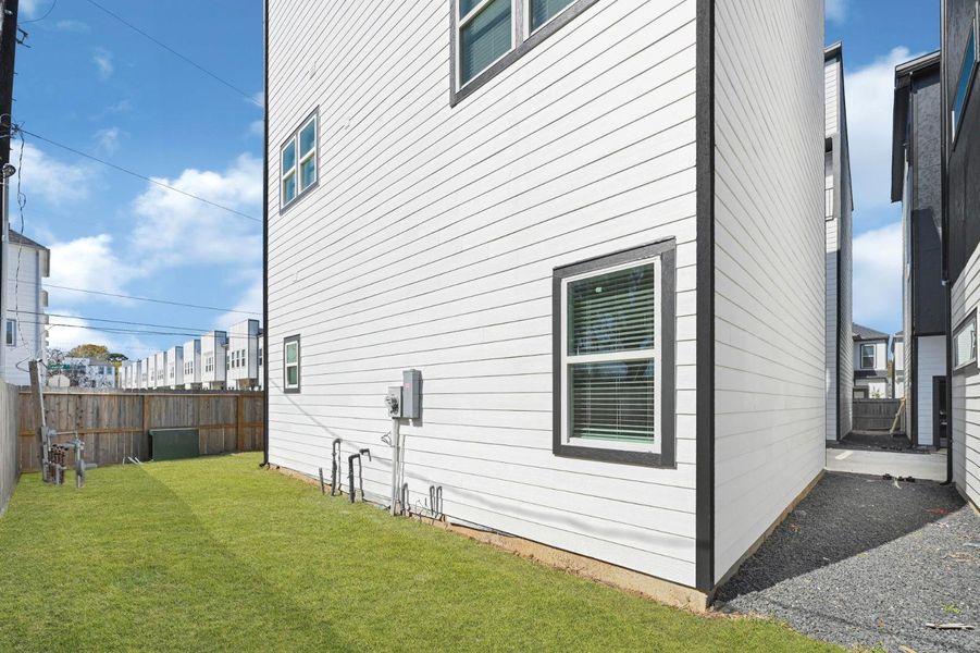 Every home includes its own fenced yard, creating a private outdoor area while maintaining the convenience of community living.