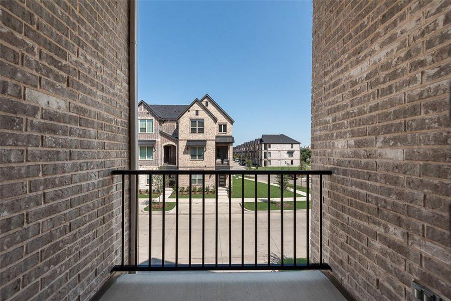 Front exterior of a new home in Wade Settlement Townhomes, Frisco, TX, highlighting curb appeal (Image 18). Front exterior of a new home in Wade Settlement Townhomes, Frisco, TX, highlighting curb appeal (Image 18).