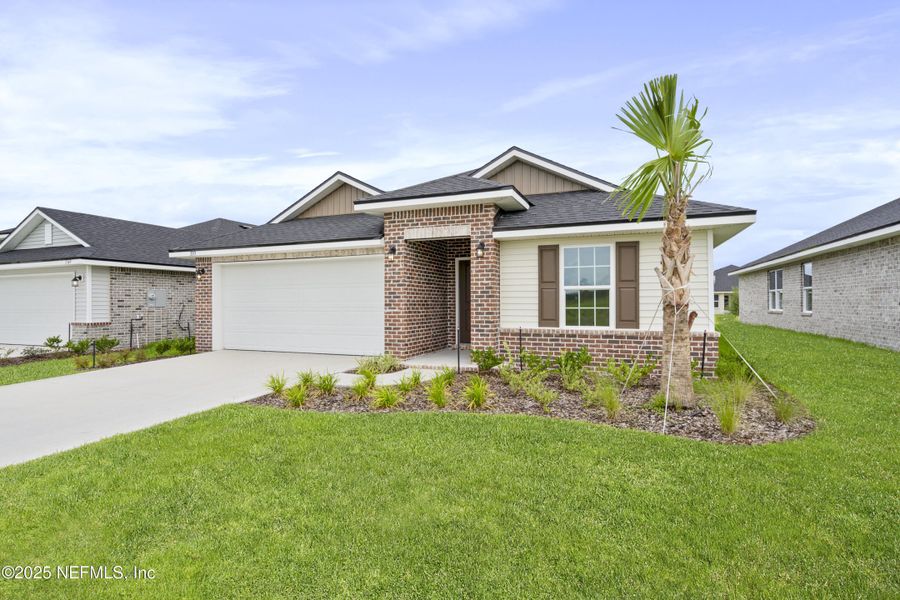 Front exterior of a new home in Shadow Crest at Rolling Hills, Green Cove Springs, FL, highlighting curb appeal (Image 16).