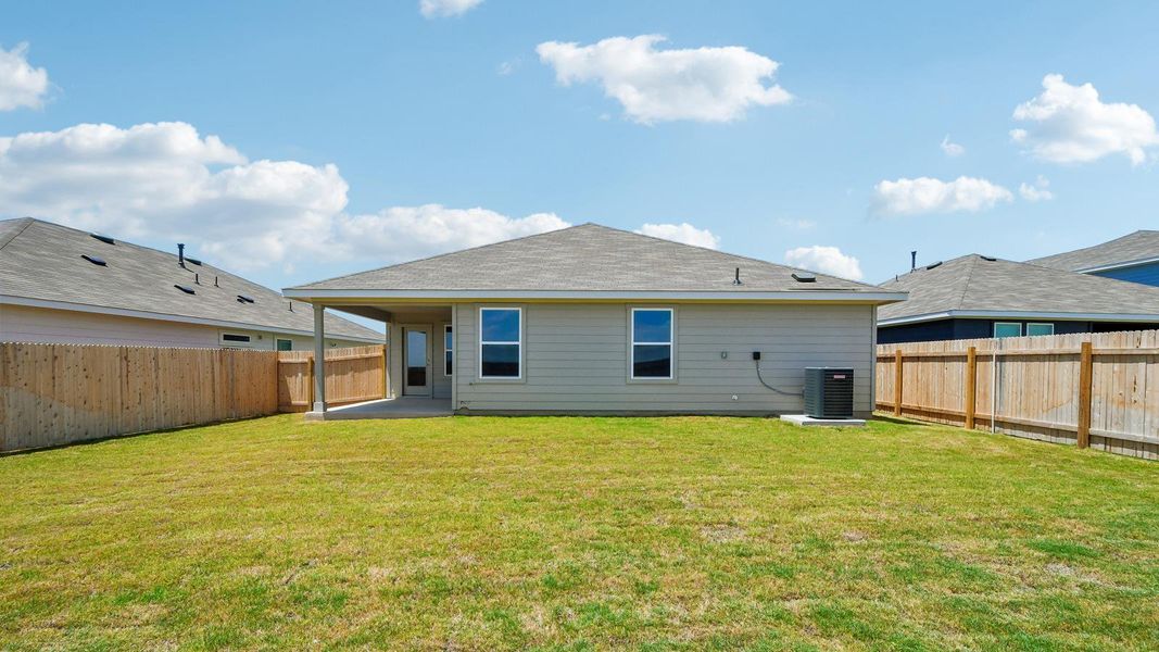 Exterior details and patio area of a home in Carillon, Manor (Image 16).