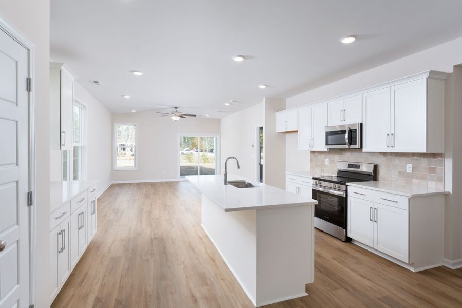 Furnished interior view inside a new home in River Tide Farms, Bolivia (Image 5). Furnished interior view inside a new home in River Tide Farms, Bolivia (Image 5).