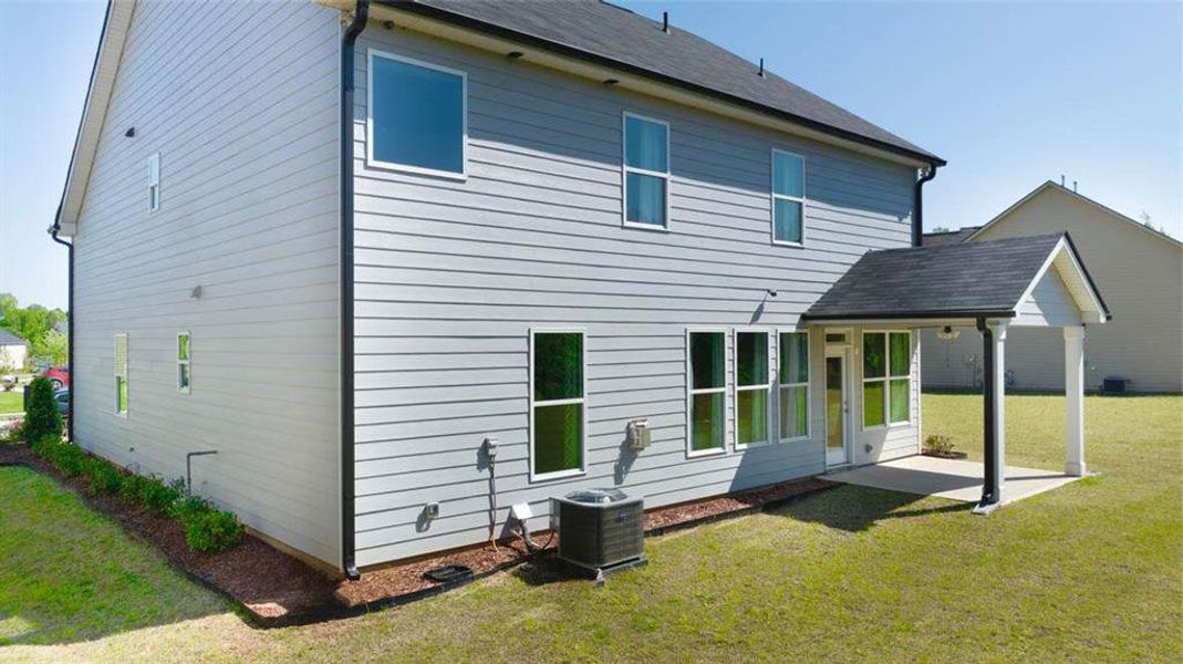 Exterior details and patio area of a home in Wildwood, Covington (Image 3). Exterior details and patio area of a home in Wildwood, Covington (Image 3).
