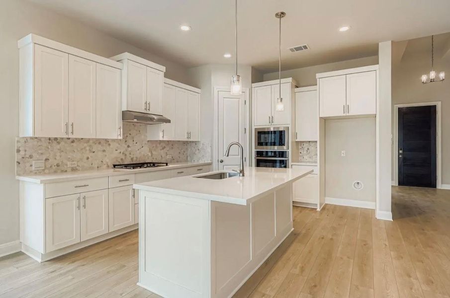 Furnished interior view inside a new home in 6 Creeks, Kyle (Image 3).