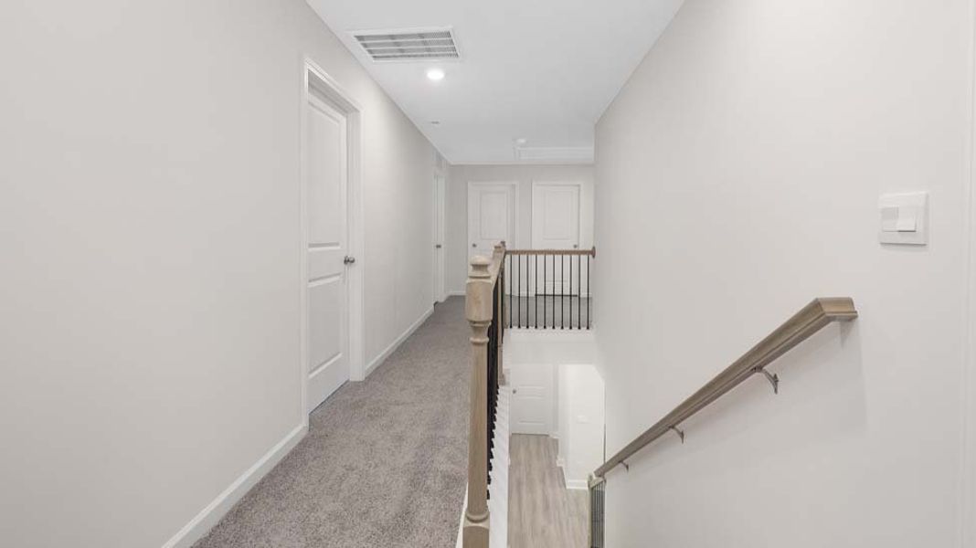 Spacious, unfurnished interior of a new home in Sanctuary at Southgate, Indian Trail (Image 19).
