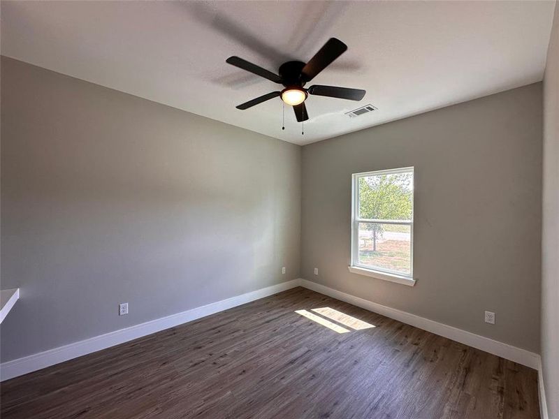 Secondary bedroom. Built-in computer or office desk. Or a vanity space for make-up. Ceiling fan. Closet.