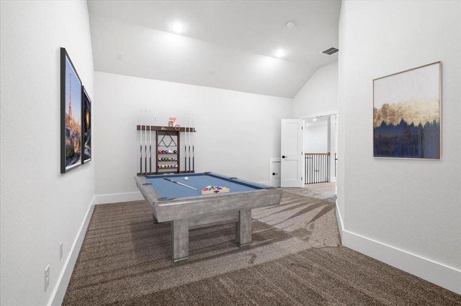 Playroom with pool table, vaulted ceiling, and carpet