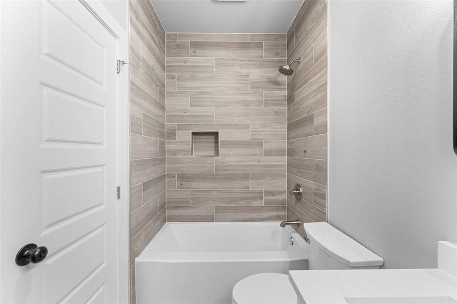 Bathroom featuring vanity and shower / bathtub combination